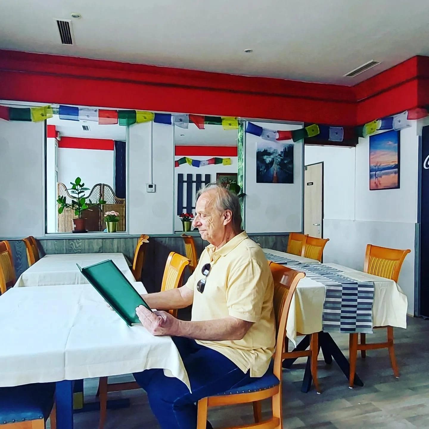 Man sitting at the table looking at the menu