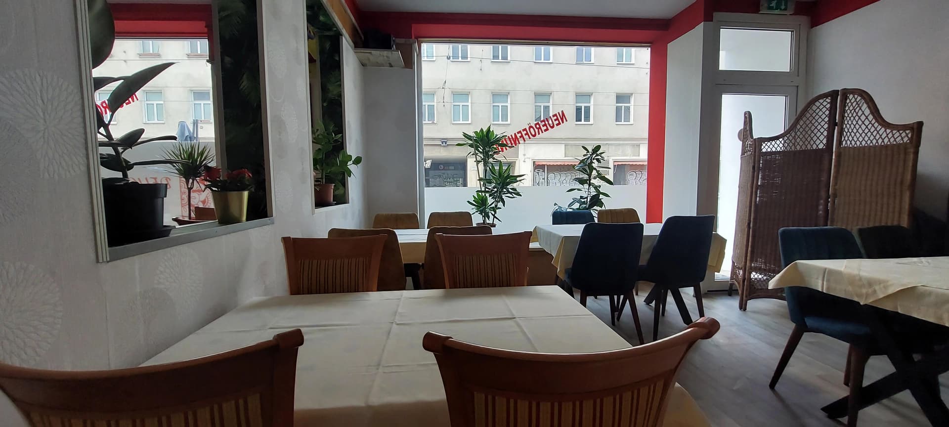 Interior showing tables with window view of outside